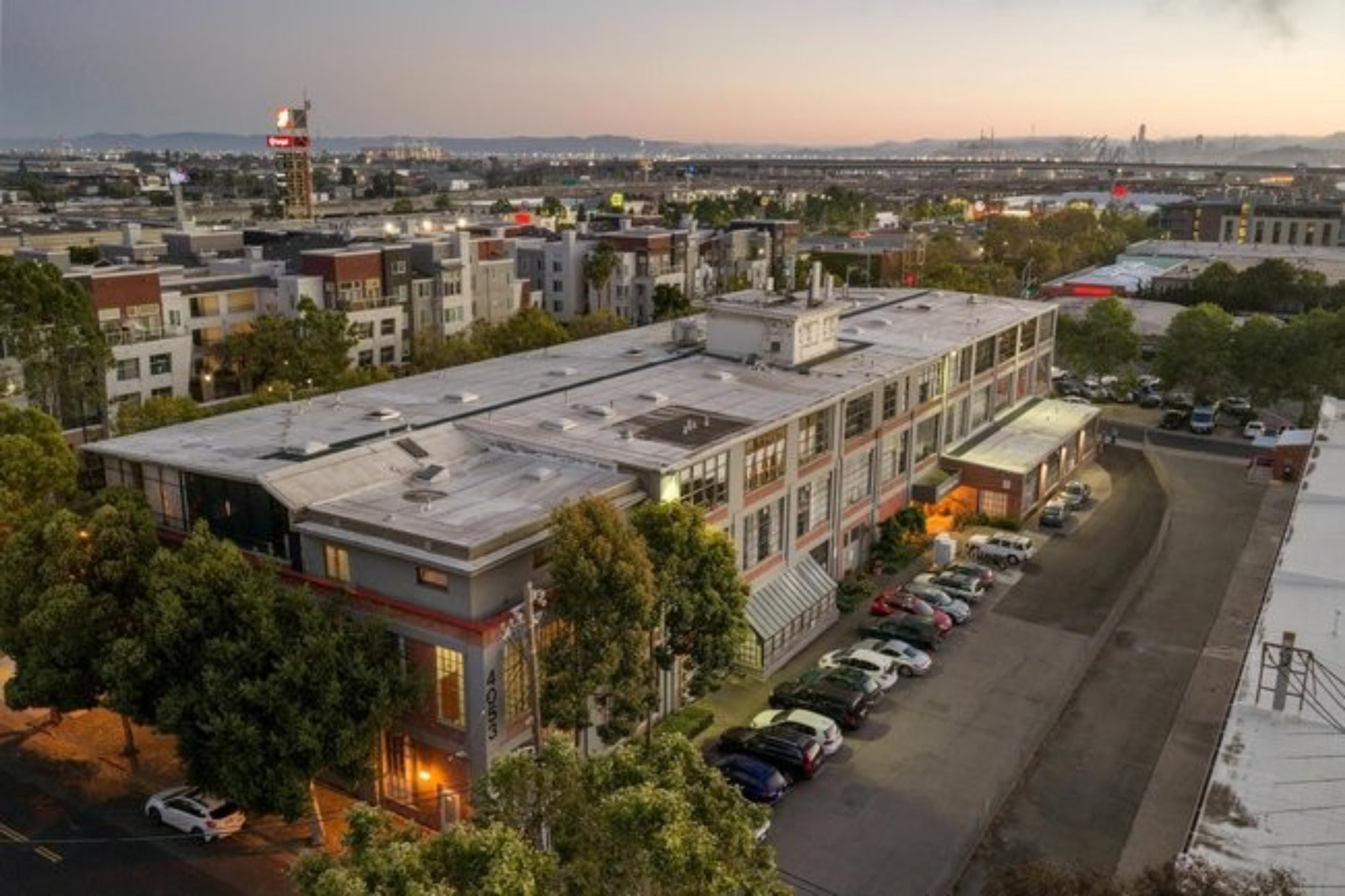  4053 Harlan St #315, Emeryville - top floor loft with massive floor-to-ceiling windows and views of the Berkeley Hills—Andy Read Realtor—Photo 1